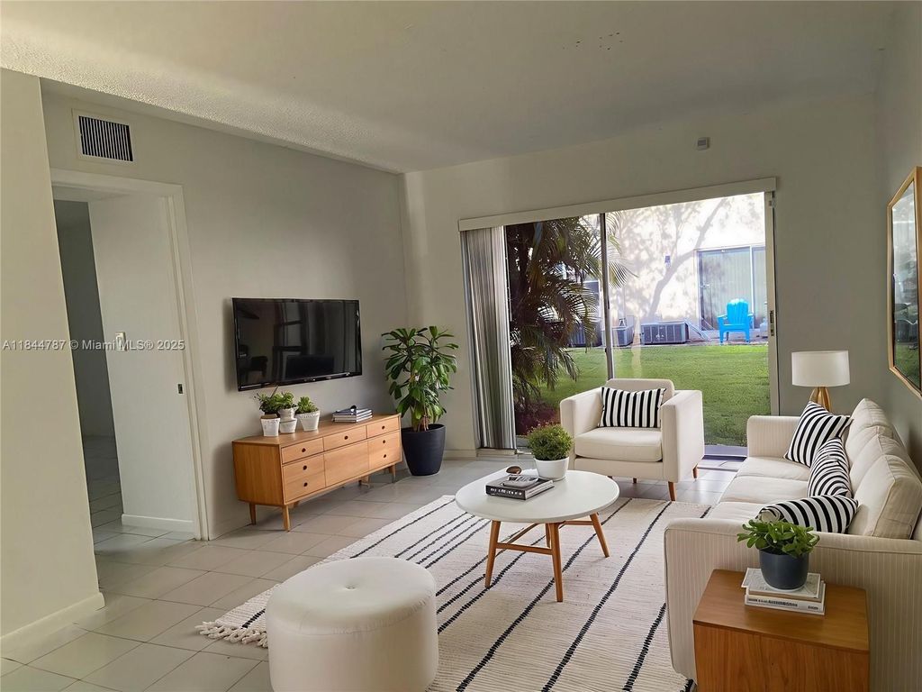 Photo of 3201 NW 103rd Ter #101-C, Coral Springs, FL 33065 (MLS # A11844787)