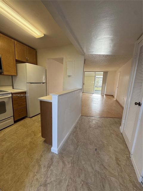 Photo of 8435 Sunrise Lakes BLV Blvd #104, Sunrise, FL 33322 (MLS # A11922905)