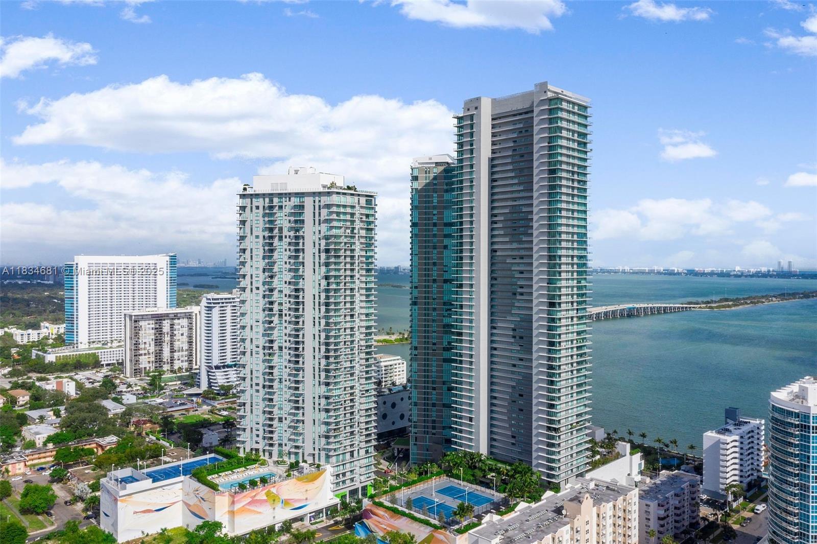 Paraiso bay is fabulous building of paraiso district in edgewater. Bayfront unit has unobstructed bay and ocean views. This luxurious unit has 2 bedrooms, 3 bathrooms and a den with open master bath concept, private elevator, top of the line bosch and subzero appliances, porcelain floors, custom closets, blinds and black out shades. Very luxurious high end amenities like pool, tennis courts, spa, cigar room, movie theater, private wine cellar, gym, treatment room, bowling alley, pool table. 5 star exclusive restaurant amara by famous chef michael schwartz. Waterfront side of midtown, miami design district and wynwood. Walking distance to trendiest restaurants, shopping and art district.