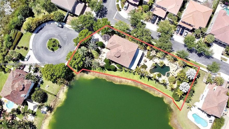 Enjoy resort living at this spectacular lakefront home on an oversized double lot with 300 ft. of direct waterfront access. Nestled in the privately gated community of Lido Isles, this home sits on the biggest lot in the neighborhood (.55 acre). The home features high double-volume ceilings, a media/office room, plus a generous eat-in kitchen complete w/ a center island, sub-zero fridge, breakfast area, & a large walk-in pantry. Accordion Shutters, NEW ROOF (2020), NEWER A/C (2020 & 2016), NEW FLOORS Upstairs (2023), NEW POOL PUMP & POOL HEATER (2023). The home shows an oversized covered terrace, an outdoor kitchen, plus a unique pool area w/ waterfall accents, a waterslide, a spa & direct lakefront views. The home is located only 30 mins from Ft Lauderdale Beach & 35 mins from Miami!