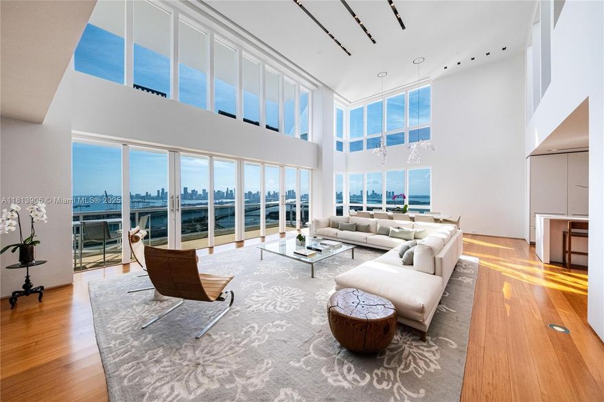 Penthouse A, the crown jewel of Murano Grande, is located in the heart of South of Fifth—Miami Beach’s most exclusive neighborhood. Spanning two floors and 5,305 SF, this architectural masterpiece was designed by Chad Oppenheim. Upon entry, you're welcomed by soaring 20-foot ceilings and sweeping sunrise-to-sunset views, of the Miami Skyline & Ocean. The Penthouse has been meticulously curated featuring a custom Boffi kitchen by Piero Lissoni, Burmese teak flooring, matching sandstone terraces, and a floating staircase. Additional highlights include Holly Hunt materials, Crestron Smart Home, a Swarovski crystal chandelier, Kreon lighting, Poliform closets, and spa-quality bathrooms with Boffi cabinetry and Dornbracht fixtures.