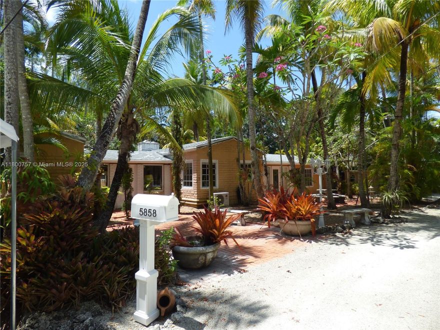 Offered at $500,000 below recent appraised value! - This classic mid-century Florida gem with a detached cottage sits on an 17,940 sq ft lot just a short stroll away from downtown South Miami. Built like a fortress with brick floors, brick walls, Dade County Pine tongue-& -groove ceilings, it has gracefully stood strong & resilient for the last 73 years surrounded by lush landscaping, screened-in decks for seamless outdoor living & a pool, it’s a true tropical retreat.  Appreciate & keep its architectural heritage with an upgraded modern update OR develop your vison as the large lot offers a rare canvas to build a stunning, 2 story, 7,000–7,500+ sq ft modern luxury estate. See MLS attachments for more details about this prime opportunity