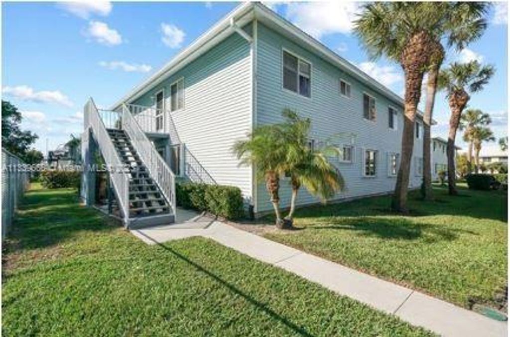 Photo of 110 SE Village Dr #110, Saint Lucie Village, FL 34952 (MLS # A11339666)