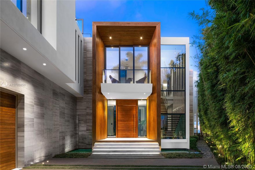 A Modern Mansion on Palm Island with a sophisticated tropical vibe featuring an open-air atrium, reflection ponds & rooftop lounge.The 12ft ceilings & flush retractable 'clear' glass windows are just one example that this is a non-spec home. Interior highlights: Fendi show kitchen, catering kitchen, breakfast lounge, wine bar, oversized theatre, elevator, & entertainment areas unfolding toward the water.The 1,500SF Master Wing boasts dual Ornare wardrobes, separate Boffi baths draped in marble slabs & massive terrace with Eastern sunrise views. Exterior details: timora wood, mosaic infinity edge pool, sunken firepit, & Summer Kitchen. For the Car Lovers-3 car garage + turntable.Privacy perks: infrared technology, steel door, and 19 cameras along with a gated island location.