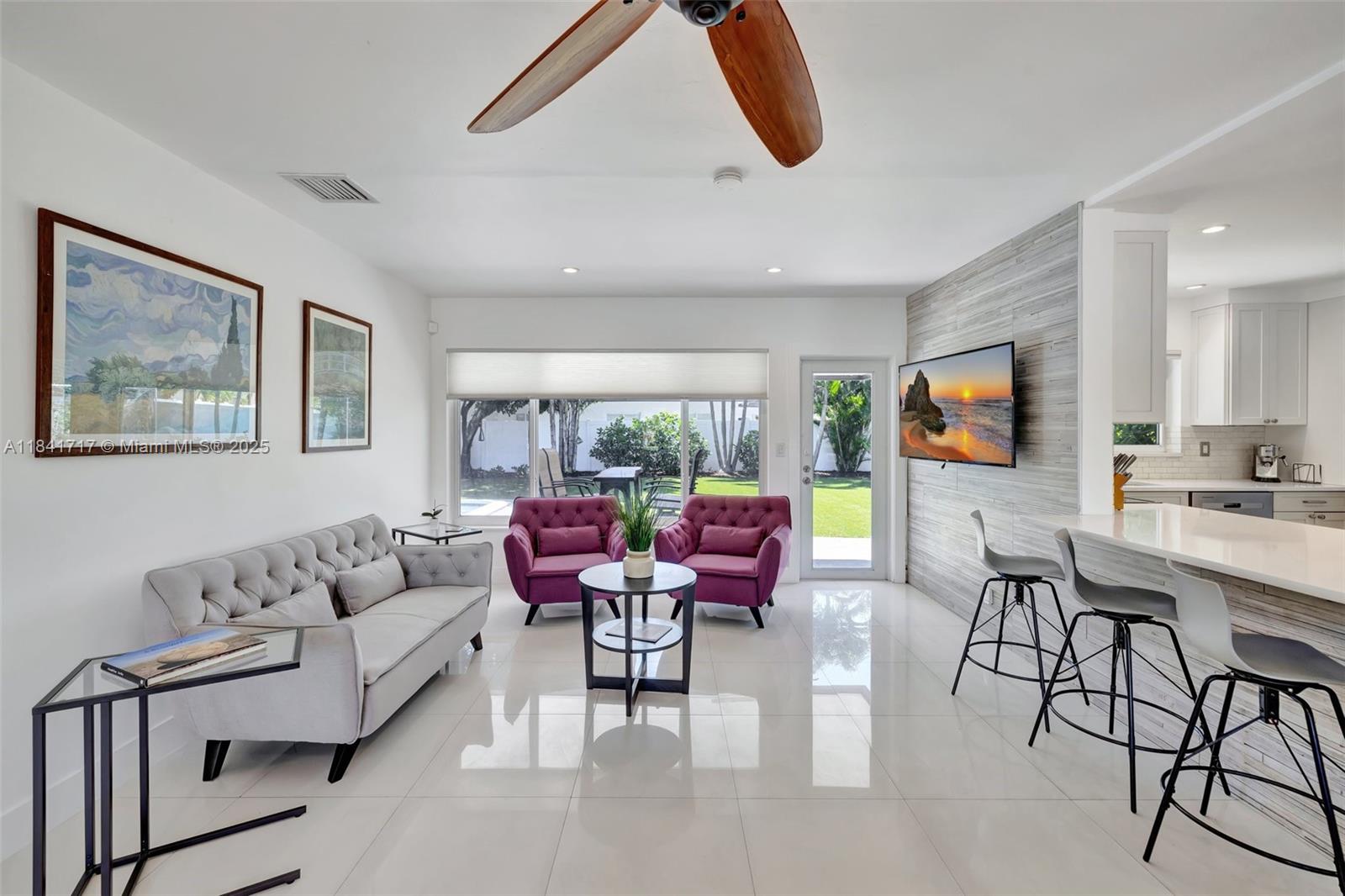 Dream home in the heart of Ft. Lauderdale! This entertainer's paradise with an expansive fenced in backyard with built in grill, pool, play & playground area, custom turf & elegant landscaping. 4 bedrooms and 3 bathrooms plus a separate office/living space make this home the perfect find. Located in the sought after Coral Ridge/Bayview school district, with just a short walk to the beach, dining & entertainment in the Galt Ocean Mile. Convenient to enjoy all the wonderful activities in downtown Ft. Lauderdale, Las Olas, FAT Village arts district & Lauderdale-by-the-Sea. Additional features: Impact windows & doors, metal roof, EV charger, porcelain tile throughout, custom white kitchen with Silestone countertops. This home is ready for you!