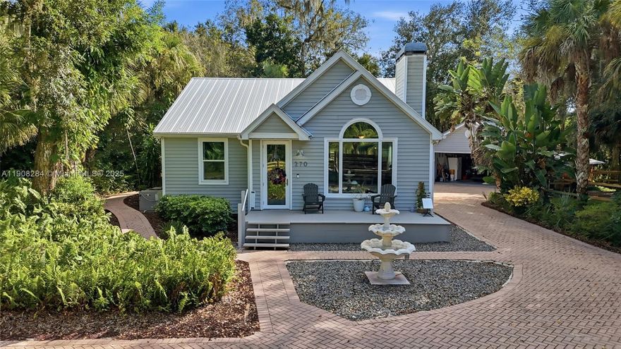 Discover charm and modern comfort in this 2-story LaBelle home on over half an acre with direct Caloosahatchee River access and a private boat dock—perfect for boating, fishing, and sunset views. Inside, enjoy vaulted ceilings, wood floors, a cozy fireplace, and a chef-ready kitchen with propane gas and a breakfast bar. The master suite features a walk-in closet, dual sinks, a soaking tub, and a separate shower. A finished basement adds space for an office, game room, or guests. Outside includes a unique chicken coop, metal roof, impact windows/doors, and a detached 2-car garage. Experience peaceful riverfront living with convenience and privacy—your Florida getaway awaits!