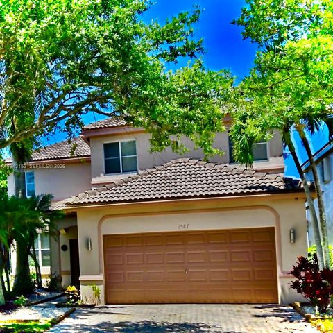 Photo of 1587 Winterberry Ln, Weston, FL 33327 (MLS # A11943152)