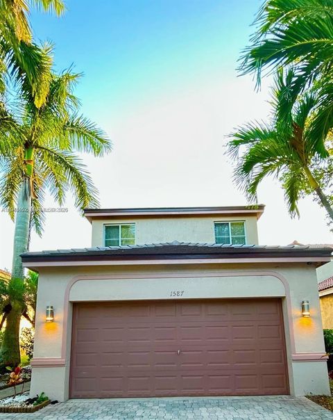 Photo of 1587 Winterberry Ln, Weston, FL 33327 (MLS # A11943152)