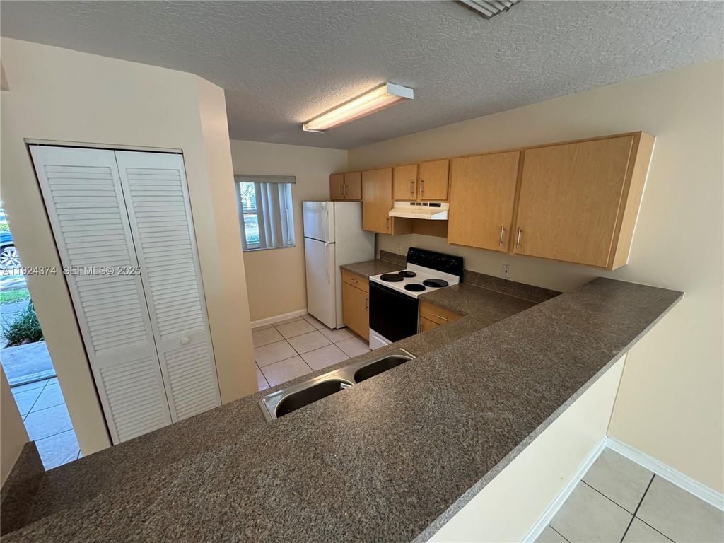 Photo of 11614 NW 37th St #11614, Coral Springs, FL 33065 (MLS # A11924374)