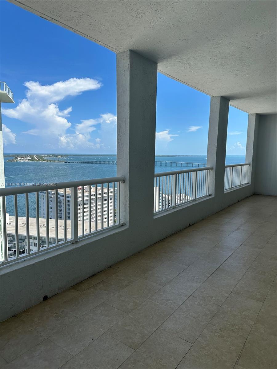 Beautiful, High-Floor 2/2 with direct Bay and Ocean unobstructed wide views. Large walk-in Closets and approx. 400SF Covered Balcony/Terrace. Covered Assigned Parking. 24/7 Security.