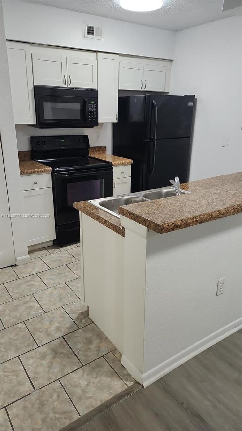 Photo of 2850 N Oakland Forest Dr #103, Oakland Park, FL 33309 (MLS # A11962778)