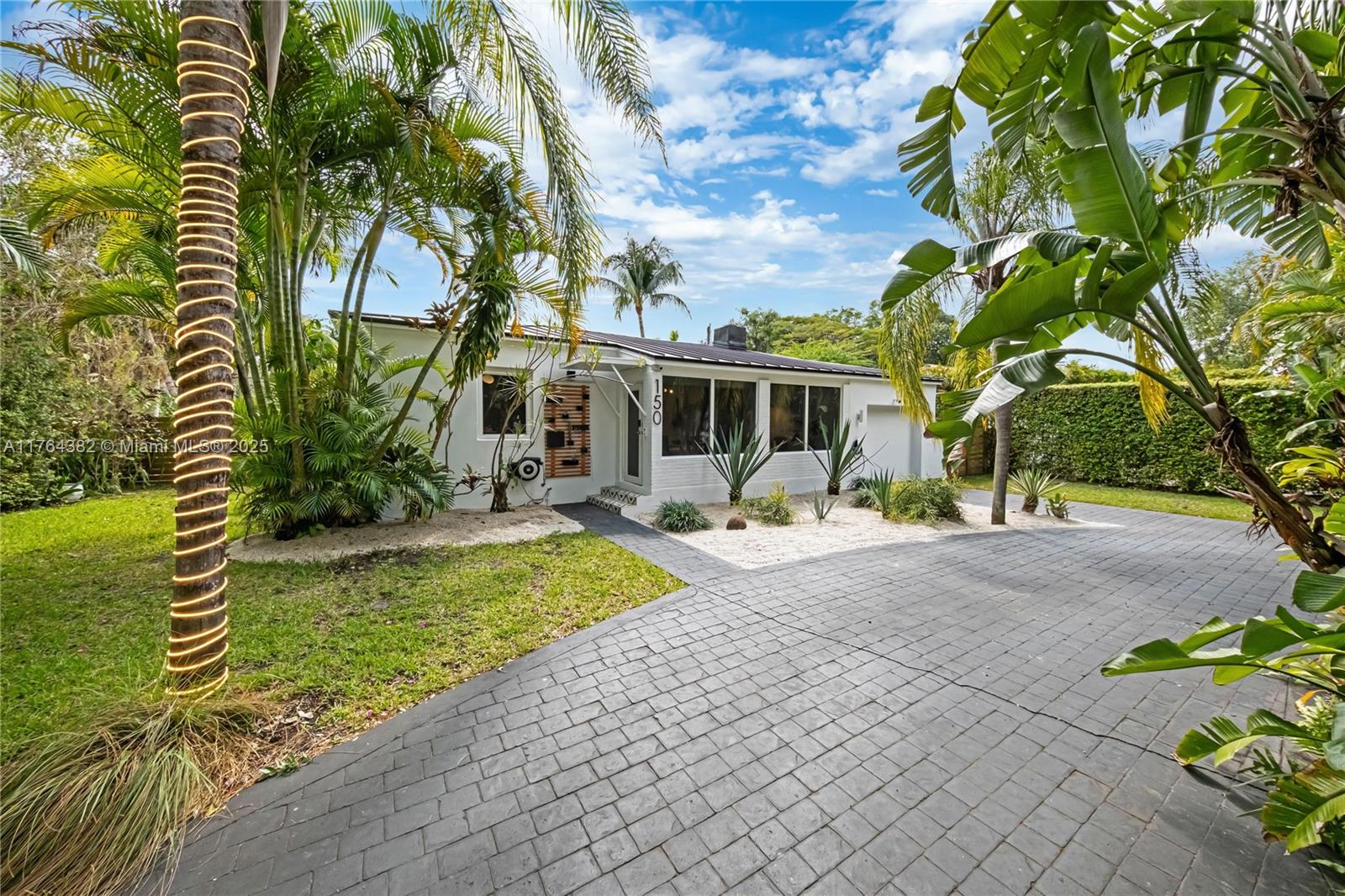 Nestled in Bonmar Park section of Miami Shores, this renovated 3-bed, 2-bath home sits on a 8,143 SF lot on a quiet dead-end street. Featuring mid-century charm with modern updates, it boasts impact windows, new electrical, new AC, and a brand-new metal roof.
The open floor plan offers stunning pool views and seamless indoor-outdoor living. The private backyard retreat features lush landscaping and a sparkling pool—perfect for entertaining. A detached 1-bed, 1-bath guest house adds flexibility for guests, an office, or rental income. Approved plans allow for an easy expansion to a 4th bedroom and 3rd bath. Steps from downtown Miami Shores, enjoy a short distance to cafes, boutiques, and stores. With top-rated schools, access to Miami Shores Country Club, and easy access to Miami Beach!