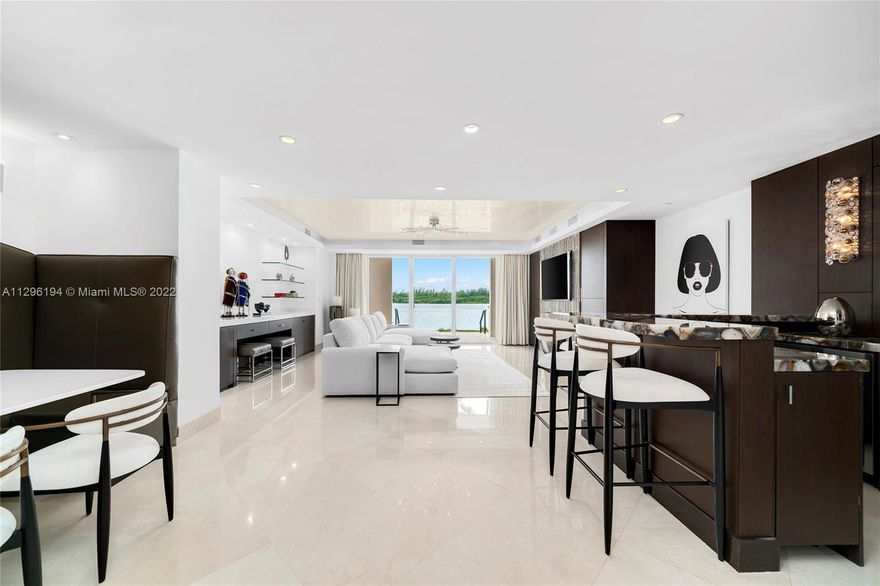 This immaculate ground floor Bayside Village unit features 3BR/3BA & 2,234 SF of custom designed interior space, a large front terrace & a second Bayside terrace w/seating areas that offers amazing views to the ocean, Virginia Key, Biscayne Bay & the Miami skyline. Marble floors throughout, spacious open living & dining room layout, fine designer finishes & millwork, custom wet bar with counter seating. Chef’s kitchen w/custom cabinetry & top-of-the-line Wolf & Sub-Zero appliances. Spacious bayside principal suite offers direct terrace access, custom closet spaces & principal bath with glass/marble shower & sunken spa tub. Amazing ground floor location next to the marina & beach club, step out to the walking path and experience the best Fisher Island has to offer. 5-star Fisher amenities.