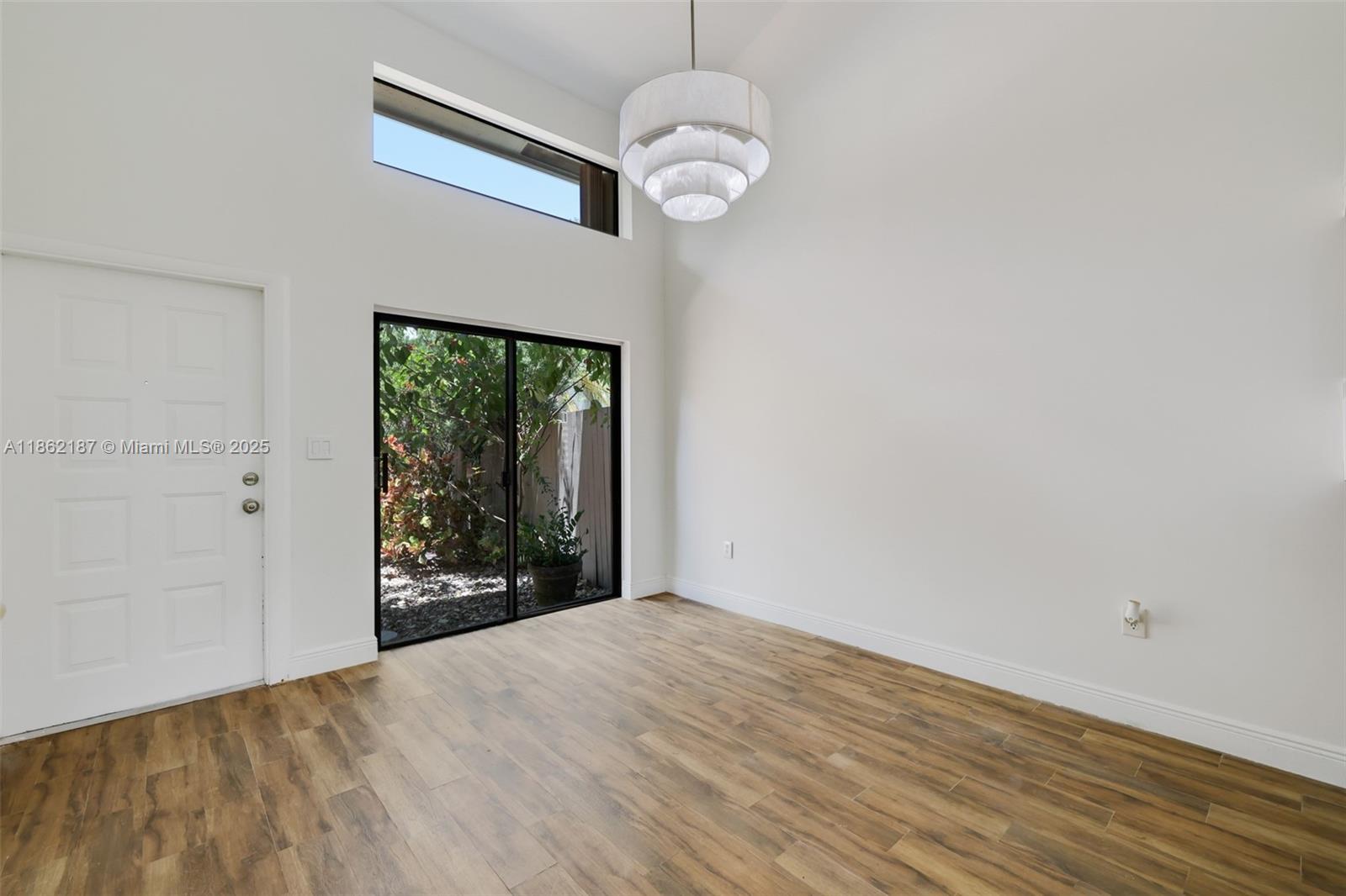 Remodeled and spacious 2 Story Townhouse with 2 car garage. Enter through an expansive private courtyard. This beauty offers vaulted ceilings, storage/closets, 2 bedrooms and 2.5 bathrooms. Large Family room overlooks patio and garden/greenbelt area. In unit laundry is a plus. On a quiet street this home is within minutes from Turnpike, Miami Dade College and walking distance to coffee shop and local eateries. Community offers many amenities: clubhouse, pool, gym, tennis, pickleball also within walking distance as well as to top rated schools.