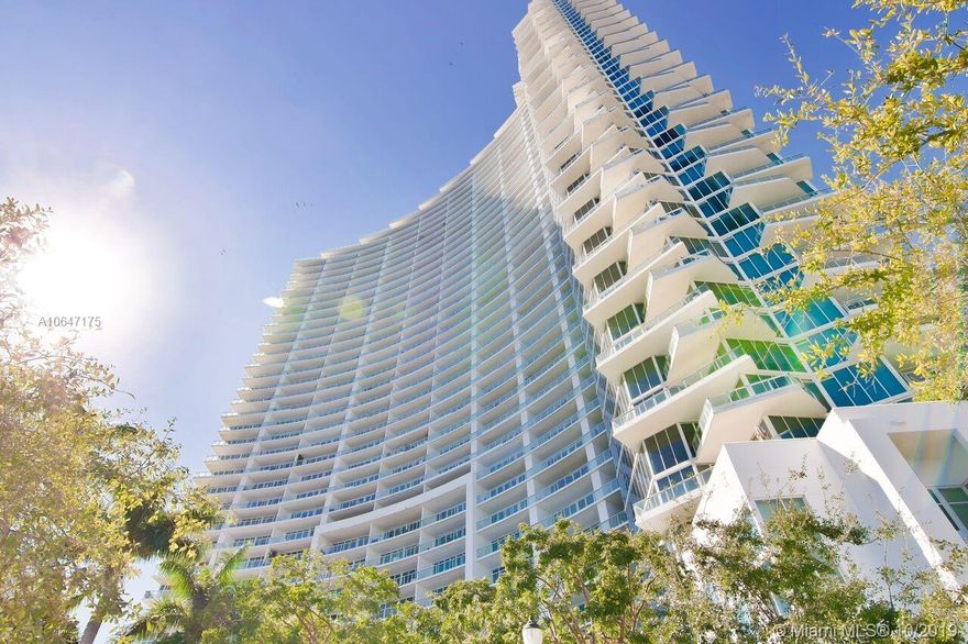 Spectacular one-of-a-kind 4Bd/4.5Bths penthouse with fantastic sweeping unobstructed 360 degree views of Miami Beach, Downtown Miami, and Uptown. The closest thing to Heaven in Miami. Gorgeous finishes + upgrades throughout, interiors by Whitney Bloom, sold fully designer furnished. Stunning  white 36x36 marble floors throughout w/12 ft. ceilings, 4,055 interior Sq. Ft. with 4 balconies. Master bedroom wing with private balcony, spa bath with dual sinks, stand alone tub, separate shower + midnight kitchen & giant his/her closets. Custom open kitchen + Subzero wine bar, separate office/in laws quarters with its own entrance.