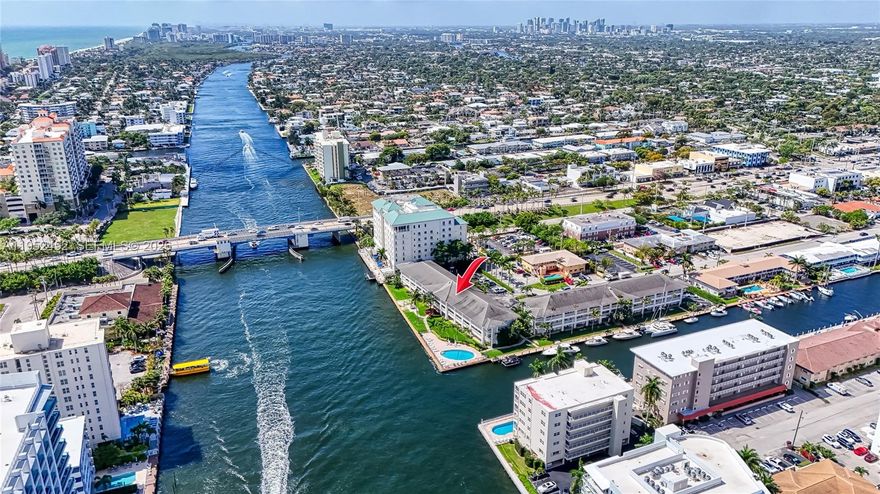 Rarely available large renovated one bedroom floor through with spectacular panoramic intracoastal views.  Fabulous restored mid-century boutique building directly on the intracoastal point with pool overlooking the intracoastal. Prestigious Coral Ridge location.  Walk to everything including the beach, shops, restaurants. Low condo fees.  Immediate rentals permitted up to 3 times a year. "Smoke Free Building"