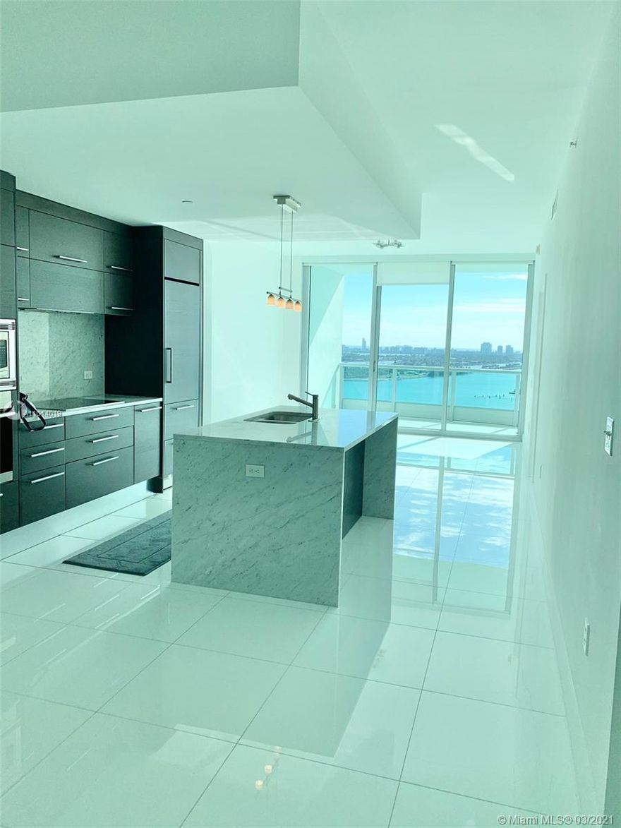 Unobstructed views from this unit. 1 Bedroom plus Den, and 2 full bathrooms. White porcelain floors throughout. Building amenities include a resort-style pool, lap pool, hot tub, BBQ area, state-of-the-art fitness center, movie theater, children's playroom, clubroom, full-service concierge, 24-hour valet parking, and a full-service spa w/ his & hers sauna & steam room.