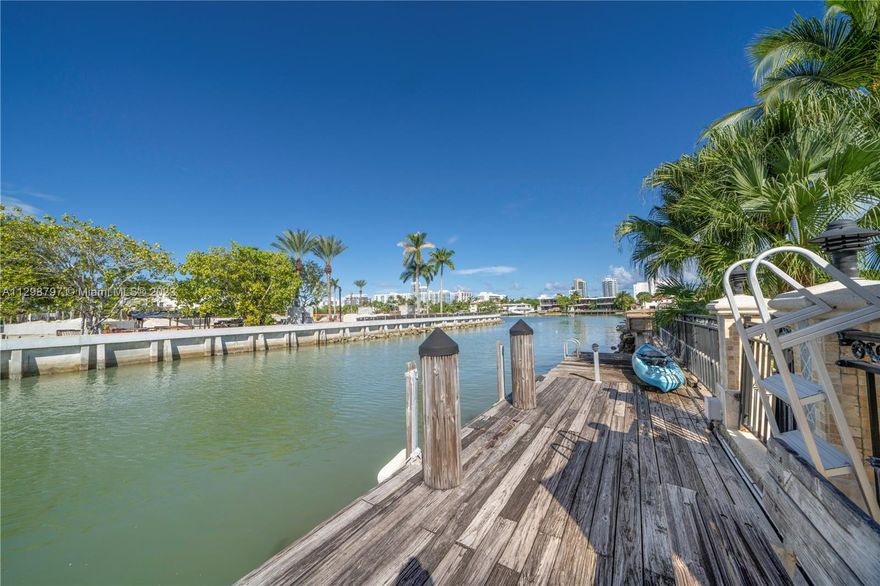 Exceptional waterfront living from this Palm Beach Regency style 6BD, 5.5BA home on prestigious Pinetree Drive Circle! Tucked away & nestled on a coveted quiet street, this home is perfect for entertaining & boasts 4,642 SQ.FT. of living space (larger than tax roll), an oversized 16,500 SF lot, 102ft of protected water frontage (no fixed bridges), gated backyard w/pool, coral stone facade & covered lanai entrance, huge circular driveway w/ 2-car garage w/electric car charging stations, & courtyard w/fountain. The elegant interiors are complete w/stunning architectural details, a gorgeous spiral staircase, fireplace, high ceilings, impact windows, eat-in gas kitchen w/breakfast bar, & 4 balconies! Terrific family-friendly floor-plan w/4BD/3BA up, & 2BD/2.5BA down (great for office/staff).