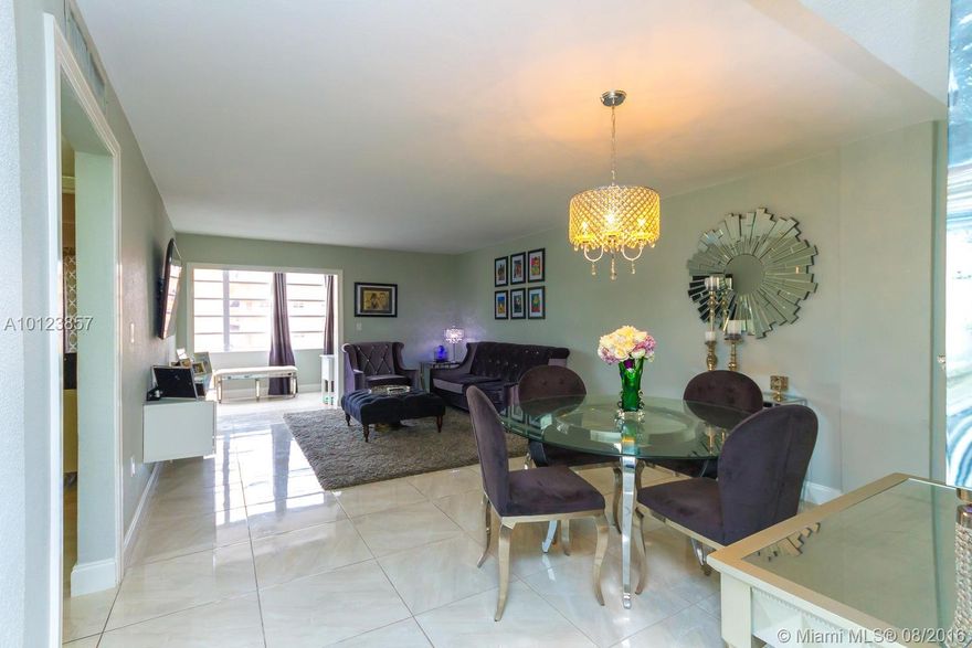 Gorgeous 2/1 in desirable West Hialeah! Near highways and shopping areas. 2 large bedrooms, 1 bathroom apartment with permitted enclosed balcony, which can be used as third bedroom. 3 assigned parking spots. Fully remodeled with tile throughout. Tank-less water heater, large baseboards, luxury light fixtures and many more extras. Move-in ready. Apt complex has lots of amenities including a pool, kids playground and tennis court.  Don't miss out! This won't last!