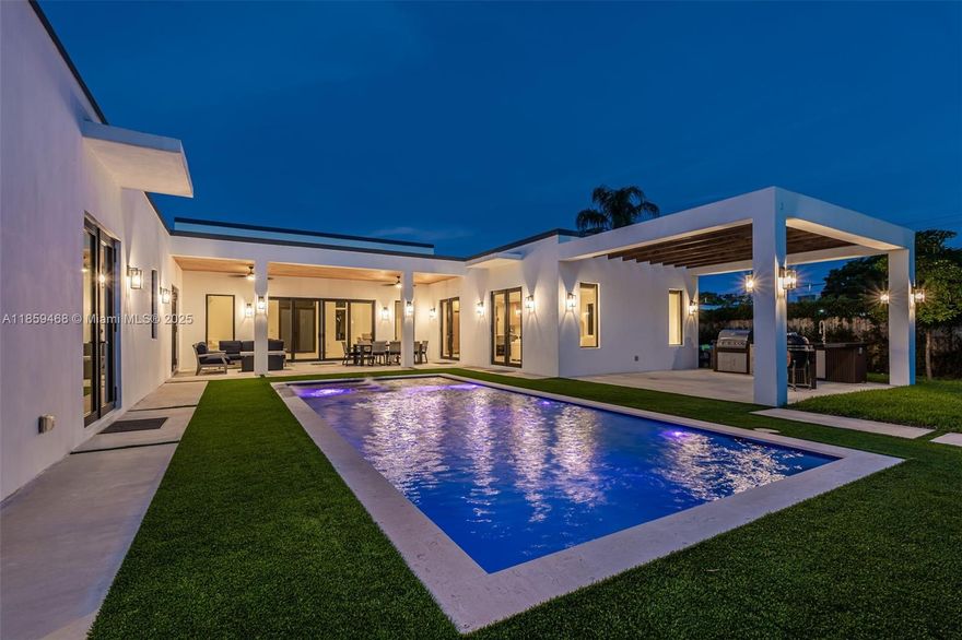 Welcome to "The Casa Zen" – a stunning new-construction sanctuary masterfully designed for refined indoor-outdoor living. This single-story 5-bedroom, 5-bath residence (plus cabana bath & outdoor shower) blends modern elegance with resort-style comfort. Soaring 13’9” ceilings, 48x48 porcelain floors, 8-ft solid wood doors, & walls of impact glass create a dramatic, light-filled backdrop overlooking the pool. The chef-inspired kitchen boasts quartz countertops, Viking appliances, gas range, wine cooler, & pantry. Spacious bedrooms offer peaceful retreats, each with sleek modern baths. Entertain effortlessly under the covered pergola with summer kitchen, heated pool, & jacuzzi. Complete with 2-car garage & EV charger — this architectural masterpiece delivers elevated luxury in every detail.