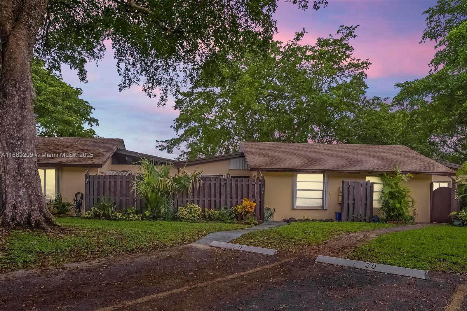 This bright and spacious home is filled with updates and offers comfortable living inside and out. Enjoy a private front patio and a screened back porch overlooking lush garden views. Interior features include ceramic and laminate flooring throughout, generous storage space, and thoughtful upgrades. Carriage Hills offers resort-style amenities including multiple pools, clubhouse, fitness center, sauna, tennis, basketball, game room, BBQ area, and scenic lakefront walking trails. Conveniently located near shops, banks, and dining, and just minutes from the Hard Rock Casino, major highways, and Fort Lauderdale Airport. This is a Must See!