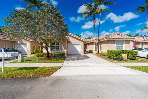 Photo of 677 NW 129th Way, Pembroke Pines, FL 33028 (MLS # A11988323)