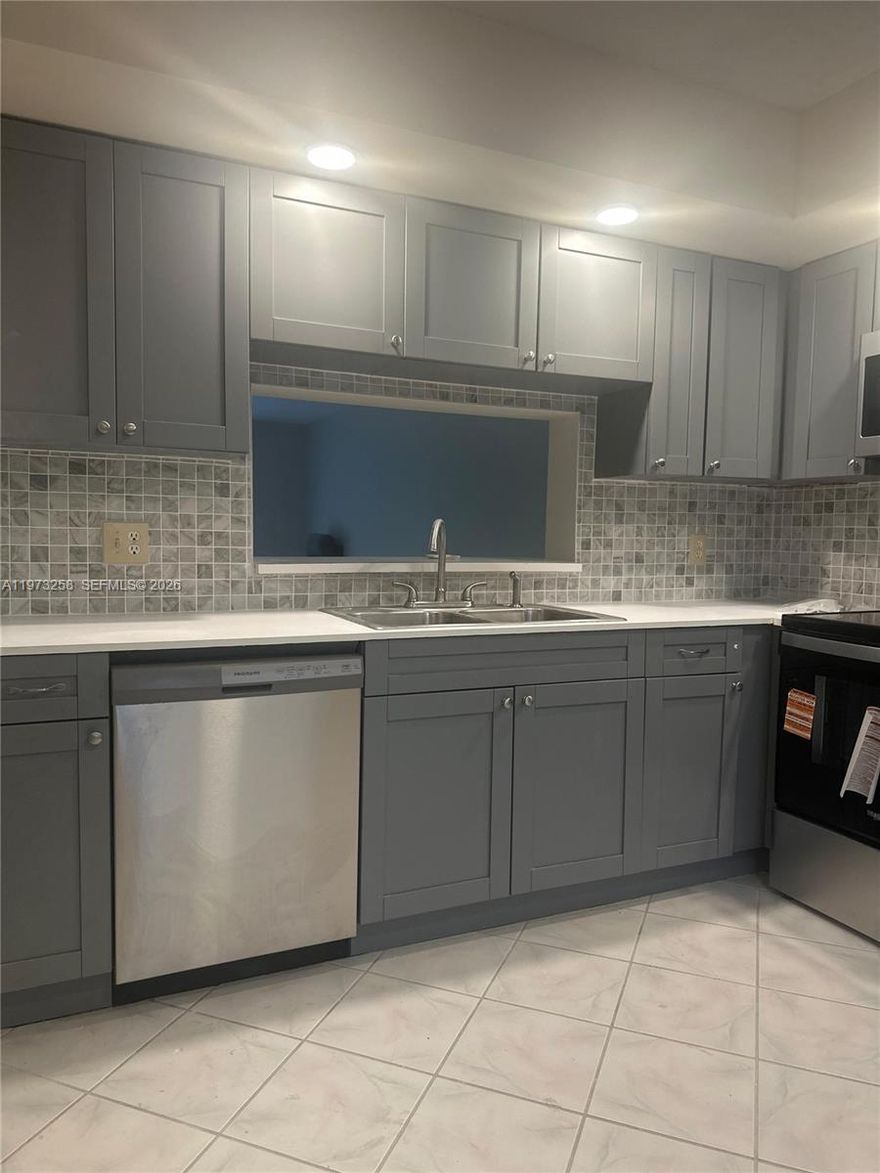 Don't miss this opportunity to own a spacious and bright 2 bedroom/2 bath unit in the resort-style adult community of Century Village. The unit features a brand new kitchen with stainless steel appliances, ceramic floor tiles in all rooms, fresh paint, new AC, and a screened patio with a gorgeous view of the golf course. The master suite has a large walk-in closet, and a separate vanity area that enhances privacy. Century Village offers residents an active lifestyle with a wide range of amenities, such as tennis, golf, pickleball, scenic walking and biking trails, and sparkling swimming pools in all sections. Residents enjoy convenient transportation by trolley that runs daily on a regular schedule. The magnificent clubhouse has an over 1000-seat theater that offers live entertainment and movies, a ballroom, a well-equipped gym, billiards, library, and conference rooms. There is a restaurant on site, as well as a medical center. Residents can join various organizations and social clubs, such as computer and art club. Association dues subject to verification.