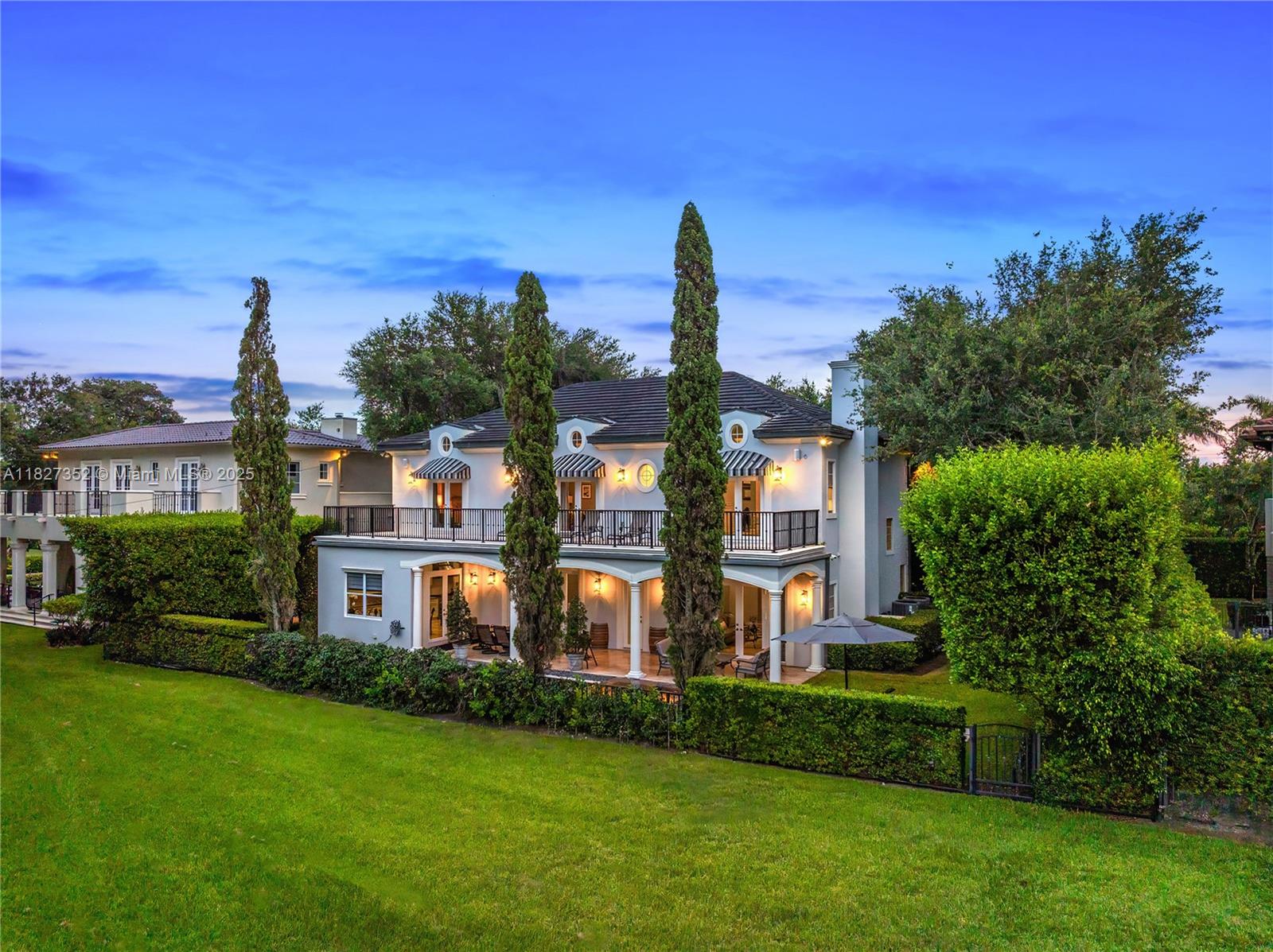 This exquisitely updated 5BD/5BA home on the Biltmore Golf Course offers beautiful views and refined living at its best. Enter through a grand foyer w/dramatic staircase, soaring coffered ceilings, and elegant formal living and dining rooms. New kitchen & bathrooms feature high-end appliances, custom cabinetry, wood & marble floors, and modern finishes throughout. Impact windows/doors, fireplace, and large French doors create a bright, inviting feel. The open kitchen, breakfast area & family room flow seamlessly for easy entertaining. A stately primary suite opens onto a balcony shared by two additional bedrooms. The gracious exterior includes a serene patio w/black-bottom pool, spa & unparalleled views of the Biltmore Hotel. A true Coral Gables gem in a premier location.