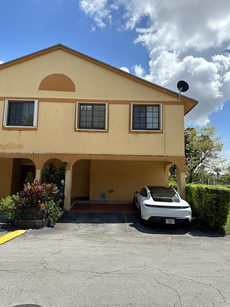 A fantastic corner unit townhome near FIU with 3 beds and 2.5 baths. Large back yard. covered parking and completely rehabbed with new appliances. 25% down payment required as the association does not have reserves. Low maintenance fee ($167). Current special assessment for 6 months @$101.67 for repair & paint of the buildings, street repairs, & mailbox replacements. 2 Parking spaces at front.