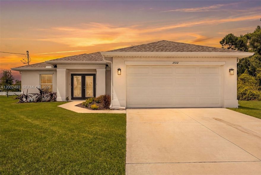 PRICED TO SELL QUICKLY! Step into modern Florida living with this like new 2023 construction home, ideally positioned in a desirable area of Cape Coral and ready for its next owner. From the moment you arrive, the double door entry creates a grand first impression, leading into a bright open concept great room designed for both everyday living and easy entertaining. Natural light fills the home, highlighting clean modern finishes and a seamless flow throughout. The kitchen is the heart of the home, featuring quartz countertops, ample cabinetry and generous prep space, perfect for gatherings or quiet evenings. A split bedroom layout offers privacy and functionality, while all four bedrooms provide comfortable space for family, guests or a home office. Laminate wood look flooring throughout adds durability, style and easy maintenance. Step outside to a large backyard with plenty of room for a pool or your dream outdoor retreat. Located just a short drive from Pine Island for boating, waterfront dining and island hopping and within reach of Southwest Florida’s white sand Gulf beaches, this home delivers the lifestyle buyers want. Move in ready with the feel of new construction, this spacious four bedroom property checks all the boxes, schedule your private showing today and experience the best of Florida living.