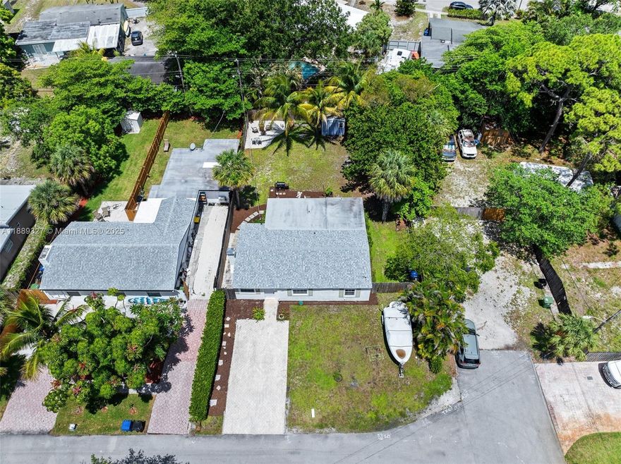 Fall in love with this charming 3-bedroom and 2 bathroom home located on a desirable corner lot in the heart of Fort Lauderdale. This beautifully updated residence features fresh paint, tile, and vinyl flooring, a cozy fireplace, stunning quartz countertops, new cabinetry, and stylish bathroom vanities. Recent improvements include a newer 2022 roof, 2020 A/C, new doors, and updated fencing. The spacious backyard offers ample room for a future pool, plus a shed and boat storage space. Just minutes from Fort Lauderdale-Hollywood International Airport, downtown, and the vibrant Las Olas Boulevard with its renowned dining, shopping, and entertainment options, this home perfectly blends comfort, convenience, & the South Florida lifestyle. Close by is a public boat dock, Cooley's Landing Marina.