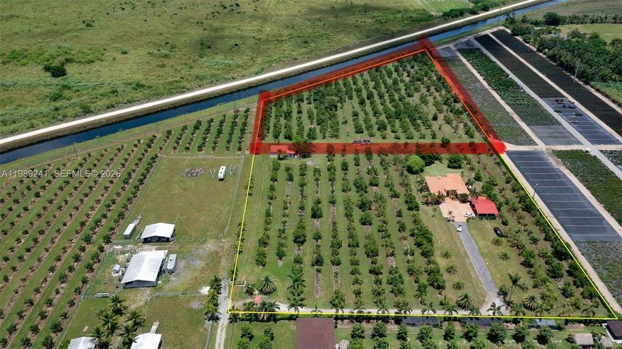 5-Acre Canal-Front Avocado Grove - Income Producing An exceptional opportunity to own a 5-acre income-producing avocado grove in the heart of Redlands in Miami-Dade County. This canal-front agricultural property features a diesel-powered irrigation pump engine, ensuring efficient watering and strong production year-round. The land also qualifies for an agricultural exemption, adding significant tax benefits and investment appeal. Taxes for 2024 were only $311.00 Perfect for building your dream home, this expansive property offers endless potential-whether you envision a private estate, an agricultural retreat, or an income-generating farm. The entire perimeter is enclosed with a brand-new fence, beautifully lined with foxtail palm trees, creating an impressive and tropical entrance. This property can be purchased separately or together with the adjacent 5 acre luxury estate, offering a rare chance to expand your farmland or create a multi-home compound. A prime Redland investment-private, scenic, and full of potential.