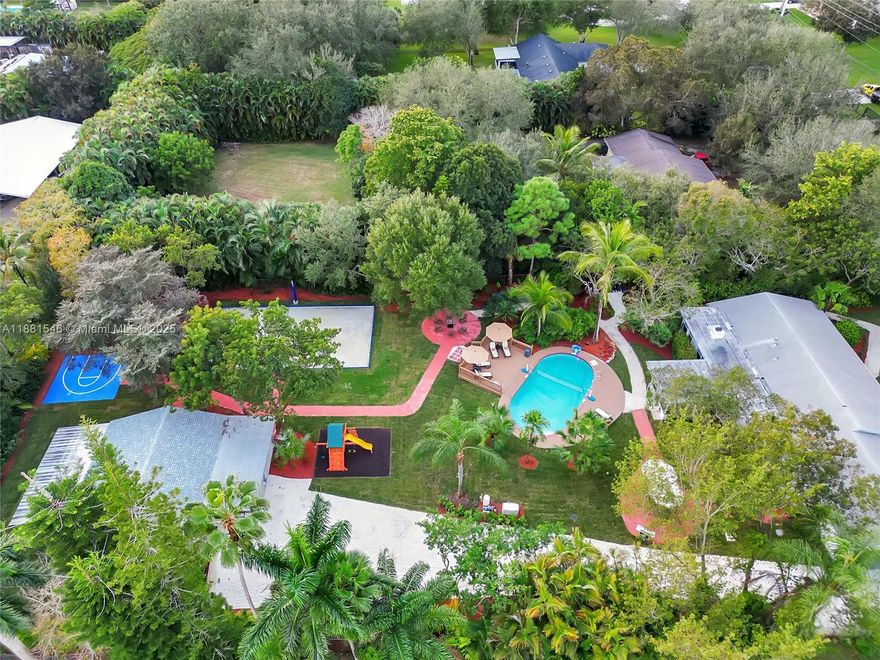 A private oasis set in Davie’s equestrian acreage community. This stunning tropical paradise boasts 8 total bedrooms, 6 being in the main house & 2 in a separate guest house. THE GUEST HOUSE ISN'T A PART OF THE SHOWN LIVING SQFT and is roughly 1200 sqft. Beautiful well-stocked kitchen, comfy bedding, & out of this world amenities. Gorgeous well-maintained landscaping surrounds the property, & outdoor amenities include an outdoor fire table, volleyball court, mini-golf course, basketball, play area, game area, & swimming pool. Spacious & private. Fully furnished and equipped, this home is a turnkey investment. Whether as a second home or income property, it can generate rental income while you’re away, managed seamlessly by a trusted management company.