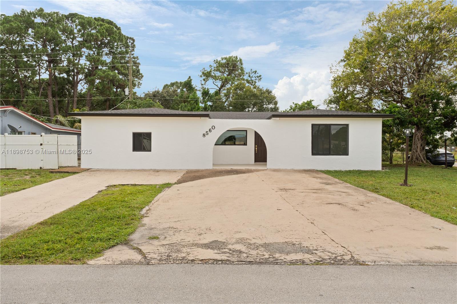 This stunning 4-bedroom, 3-bath residence features two spacious master suites and a convenient cabana bathroom. The open-concept floor plan offers seamless flow between living, dining, and kitchen areas—perfect for entertaining. Enjoy Florida living at its finest with a sparkling pool and private outdoor space. Home has been fully updated, including a new roof, with permits in process for the driveway. Situated on a desirable corner lot in a quiet neighborhood, this move-in-ready home with possible income producing potential or great for guests to have their own privacy this home combines modern comfort and style in every detail.