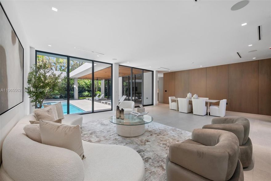 NEW CONSTRUCTION PRICED TO SELL. Welcome to this modern residence in Bay Heights, one of Coconut Grove’s most exclusive enclaves with 24/7 police monitoring. This six-bedroom, six-bathroom home is thoughtfully designed for today’s luxury lifestyle, blending clean architectural lines with warm, sophisticated finishes throughout. The heart of the home is a custom Italian kitchen outfitted with Miele appliances and natural gas, perfectly suited for both everyday living and elevated entertaining. Expansive living spaces flow seamlessly to the outdoors, creating an effortless indoor-outdoor experience ideal for Miami living. The second level features four spacious bedroom suites, each with walk-in closets, offering privacy, comfort, and a true sense of retreat. Outdoors, a saltwater pool and spa, lush landscaping, and a separate gazebo with BBQ create a private oasis for relaxation and entertaining year-round. Additional highlights include a two-car garage plus two-car carport, smart design details, and exquisite finishes throughout. This is a rare opportunity to own a move-in ready luxury home in the heart of Coconut Grove—where elegance, security, and lifestyle come together effortlessly.