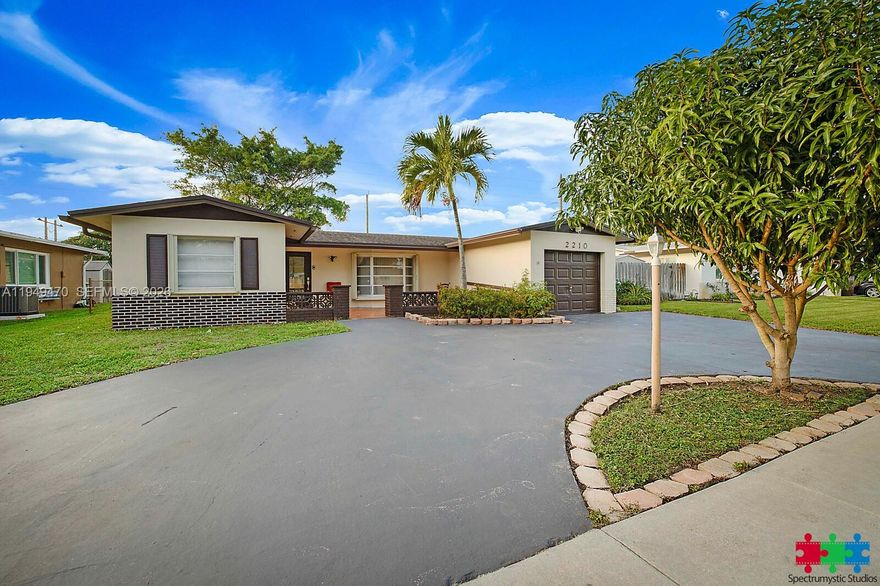 Rare opportunity to own one of the largest homes in this desirable Pembroke Pines neighborhood. This spacious 3-bedroom, 2-bath,one car garage residence offers approximately 2,377 square feet of living space, making it a true standout in the area. The thoughtfully designed open-concept layout features a seamless dining and living area ideal for entertaining, along with an expansive open family room that serves as the heart of the home. The updated kitchen and bathrooms showcase modern finishes, while a newer roof (2014) adds long-term value and peace of mind. With a versatile floor plan offering the potential to convert to up to 5 bedrooms, this home provides exceptional flexibility. Accordion shutters throughout enhance both convenience and storm protection. Enjoy a beautifully sized backyard with no rear neighbors—backing to a serene open field for added privacy and tranquil views. No HOA, offering complete freedom and convenience. Circular driveway with room for multiple cars leads to a 1 car garage.