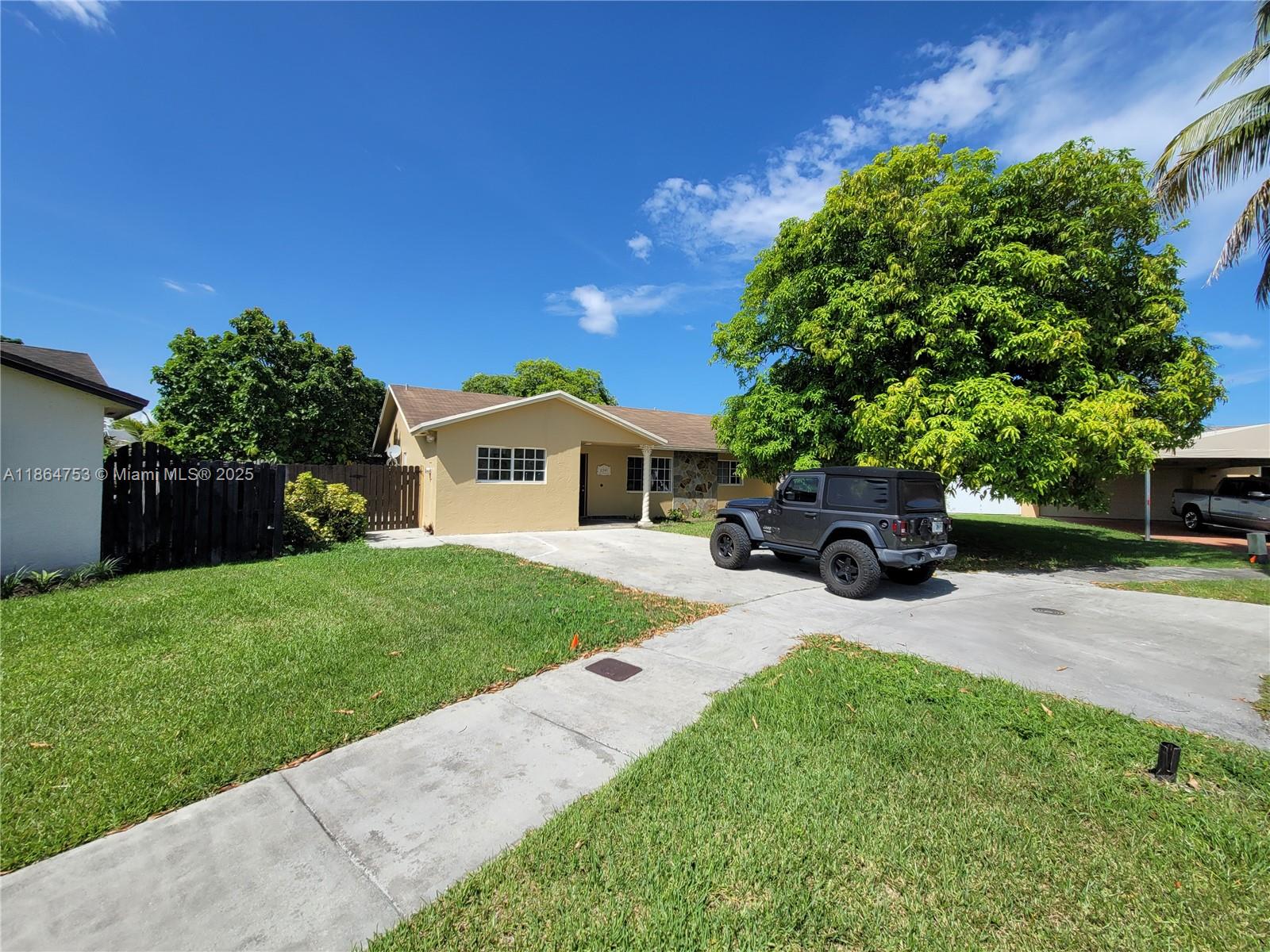 Absolutely beautiful large 5 bedroom, 2 bath home in a very private cul-de-sac dead-end street. Extra large, fenced, 12,755 Sqft lot, which is about 2 times the size of the average lot in the area, with many fruit trees. Back yard screened porch (just painted, re-screened and new door added). Top quality impact doors and windows. Easy access to turnpike, shopping and the Miami zoo.