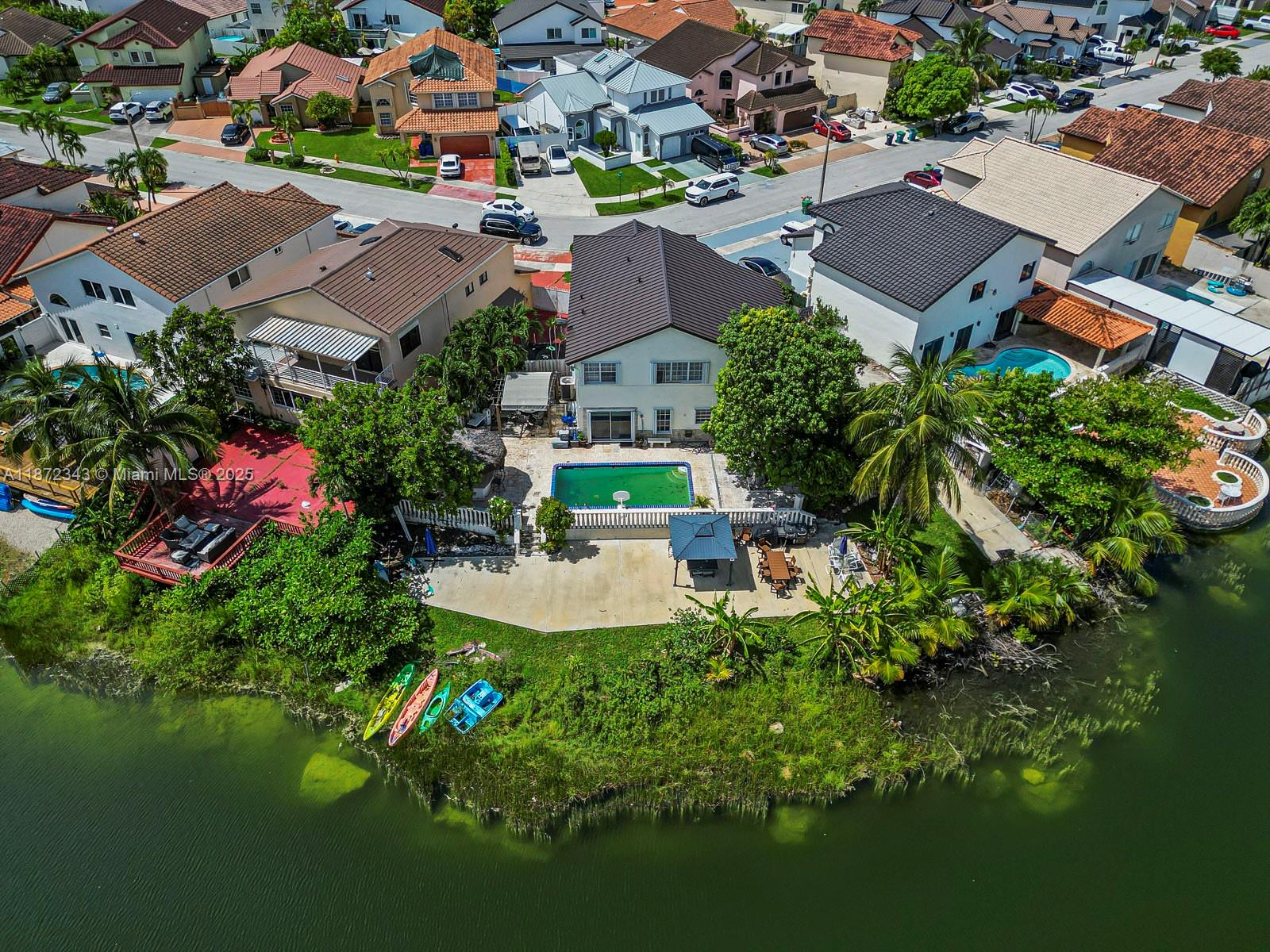 UNIQUE LARGE PREMIUM 1 ACRE LOT PROPERTY, 5BEDS 4BATHS , 1 YEAR OLD METAL ROOF(LAST 50 YEARS), NEW POOL, LAKE FRONT HOME, NO ASSOCIATION COMMUNITY, TWO MASTER BEDROOMS ONE IN FIRST FLOOR, NEW STAINLESS STEEL APPLIANCES,NEW BATHROOMS AND KITCHEN, SHUTTERS,LARGE PARKING ON THE SIDE FOR 8 CARS AND OR A VERY LARGE BOAT, GREAT MALLS, EXCELLENT A++SCHOOLS, ENJOY THE PRIVATE LAKE VIEWS AND SUNSETS ON THE BEAUTIFUL AND RENOVATED BACKYARD, DONT MISS THIS OPPORTUNITY TO OWN THIS AMAZING AND UNIQUE LAKE FRONT PROPERTY.