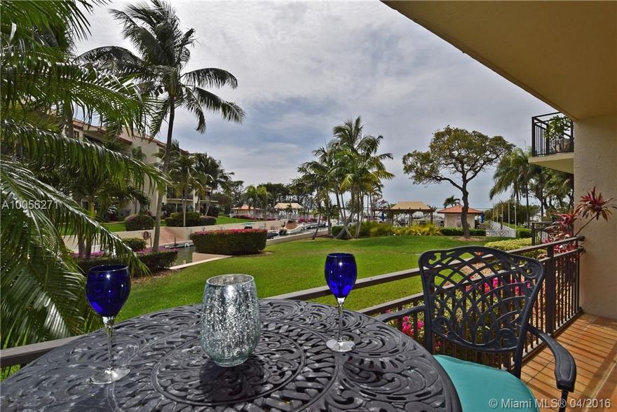 Superbly updated bayfront condominium in sought after bldg. C of Tamarind Bay. Customized and updated. Granite counters, recessed lighting, custom kitchen & baths. Views of the Bay. Keep your boat right behind your condo in protected assigned dock. Ground level, walk right out your back door to your boat. Sunsets Nightly. Tiled throughout. 1 hour to MIA. 2 Pools, Tennis, Boat Storage & Ramp.