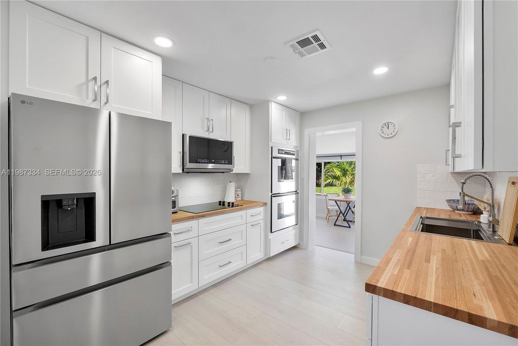 Photo of 885 Camellia Ct, Plantation, FL 33317 (MLS # A11987334)