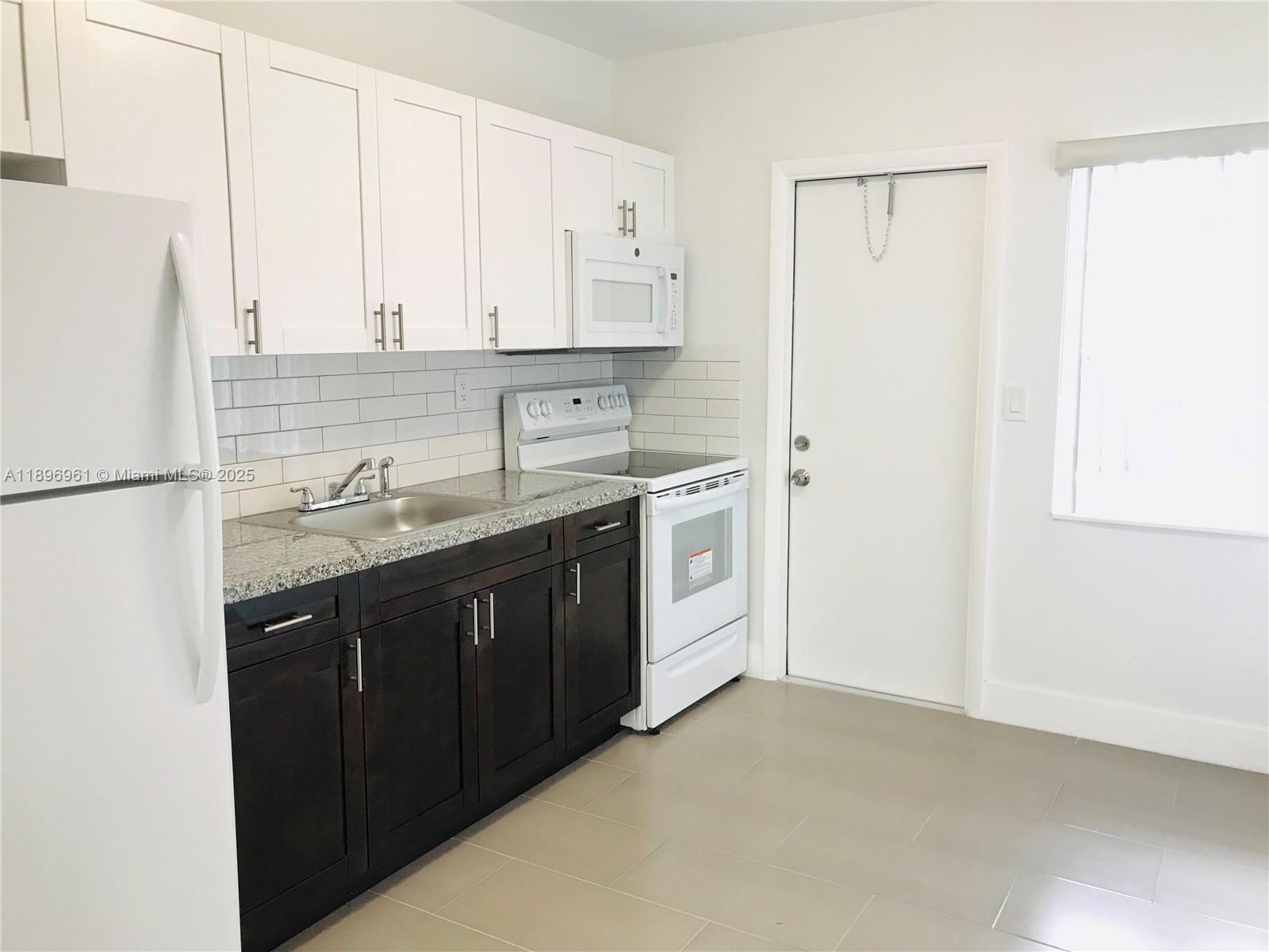 *DUPLEX* Beautiful Modern Style completely renovated apartment located in Buenavista Gardens. Minutes from the Design District, Wynwood, Midtown & I-95!. THIS UNIT FEATURES 2 SPACIOUS BEDROOMS, TILE FLOOR THROUGHOUT, 1 MODERN BATHROOM, WASHER AND DRYER. IMPACT WINDOWS. Central A/C, (2) Gated parking spaces. SAFELY PARK YOUR CAR INSIDE THE GATES. Private backyard perfect for great BBQ's and family fun. No Pets