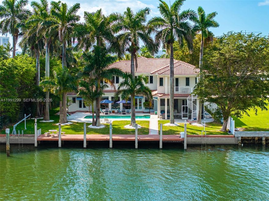 Two-story waterfront property in Hollywood Lakes featuring 100 feet of waterfront on an expansive 100’ x 234’ lot. built in 1996 and totaling 23,401 sq. ft., over half an acre on the water, a rare find in South Florida. Enjoy beautiful wide open water views across more than 450 feet of Southlake, offering exceptional privacy and openness. This waterfront property is ideal for boaters, provides deep water, ocean access, and no fixed bridges. Centrally located between Fort Lauderdale and Miami, with convenient access to both ocean cuts of Port Everglades in Fort Lauderdale to the north and Bal Harbour cut to the south. Home provides bright, sun-filled interiors with abundant natural light throughout. This 6BR/5.5BA residence features volume ceilings, a double-height formal living room, formal dining room, and family room, along with natural gas to the property and full house generator. The waterfront estate is ready to make your own and update to your wants and needs. Additional features include a 2-car garage, oversized circular driveway, and expansive backyard with pool perfect for enjoying the waterfront lifestyle. Hollywood Lakes is between both International airports with nearby shopping in Aventura Mall, the Shops of Bal Harbour as well as shopping and dining in Fort Lauderdale. Experience the South Florida Waterfront Lifestyle.