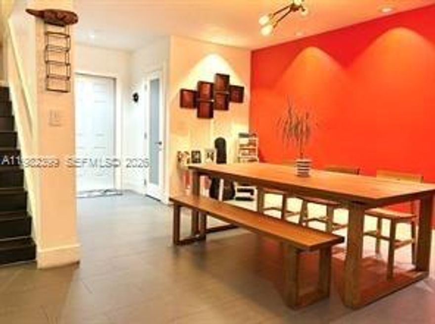 One-of-a-kind updated corner 3/2 and 1/2 bath townhouse located in the heart of North Miami (bordering Biscayne Gardens and Golden Glades). Featuring an incredible 4-car parking capacity with a 2-car garage, plus an additional 2-car covered carport. Huge oversized L-shaped backyard featuring maintenance-free astroturf, multi-level Brazilian Ipe wood deck with functioning waterfall. Open floor plan with plenty of lighting features tile and wood floors, full size Washer/Dryer with laundry sink, custom Kitchen with stainless appliances and island, custom blinds and large French doors leading to patio, custom lighting with dimmers, walk in closets. Too many upgrades to mention. Close to major highways, I95 and Turnpike, schools and restaurants.. Easy to show and rent..