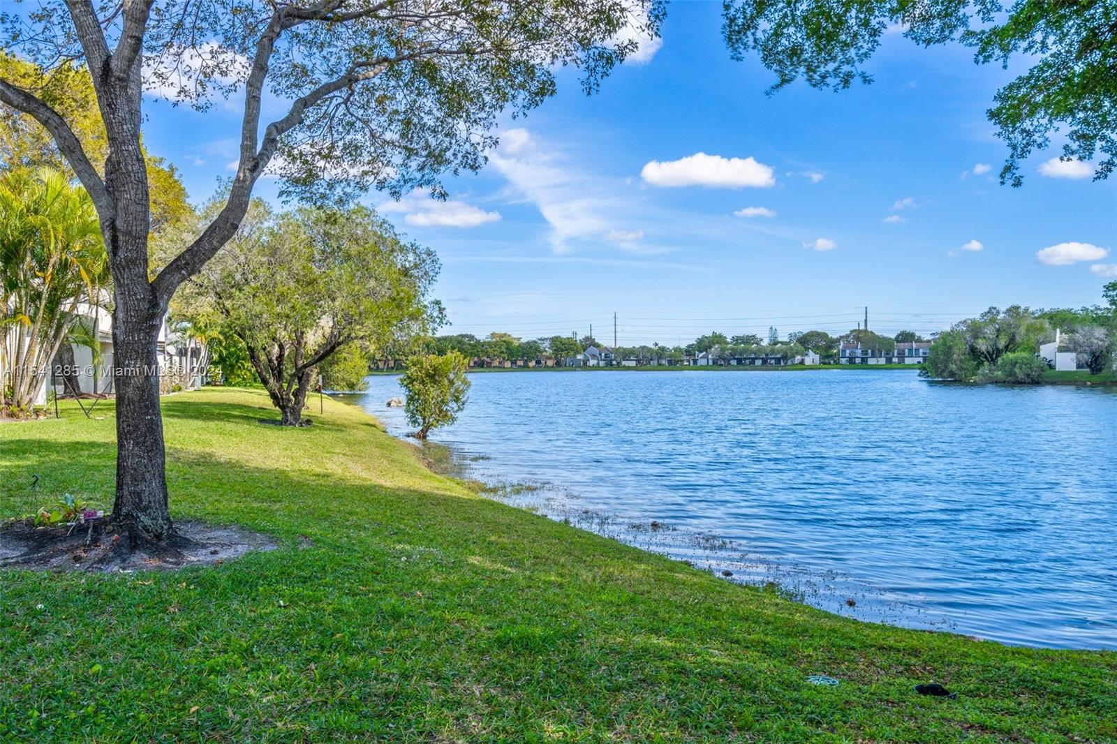 Just reduced! This 2 bedroom, 2 bath corner condo/villa in an all age community is in an excellent location with a beautiful lake close by and nestled among lush trees in a quiet neighborhood. You will enjoy the beautiful fully screened back porch for friends and family gatherings. Porch has access to primary bedroom and to office/den that can also be turned into a small bedroom. Condo has been nicely maintained and is in move-in condition ready for its new owner. Full size washer and Dryer are inside the unit off of the kitchen.