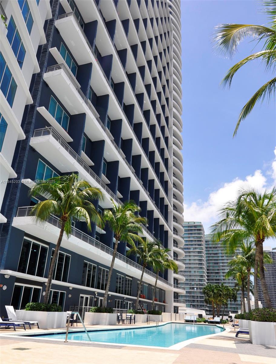 Marvelous 1 Bed, 1.5 Bath. Infinity at Brickell two-story Loft style unit with pool and city views. Open balcony overseeing the pool area. Bedroom upstairs, Tile floors, granite countertops, stainless steel appliances, washer & dryer inside unit. State of the Art Amenities: Fitness Center & Spa, valet parking, clubhouse, pool. A Must see