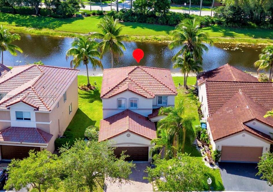 Only 2-STORY LAKEFRONT HOME IN SAVANNA FOR UNDER $900K!!! Lakefront Home in Weston's sought-after Savanna community. This charming 3-bedroom, 2.5-bath home is bright and cozy with 24x24 porcelain tile downstairs and wood flooring upstairs. The tastefully updated kitchen features stainless steel appliances, white cabinetry. The principal bedroom includes a large walk-in closet, while custom lighting and accent stone walls throughout the home add a touch of elegance. laundry with newer washer and dryer and accordion shutters on all windows. Step out onto the screened back porch—the perfect spot for your morning coffee or evening wine while enjoying serene lake views. Savanna offers a heated lap pool, 3 kids pools, a huge common pool, miniature golf and an on-site cafe. All "A" schools.