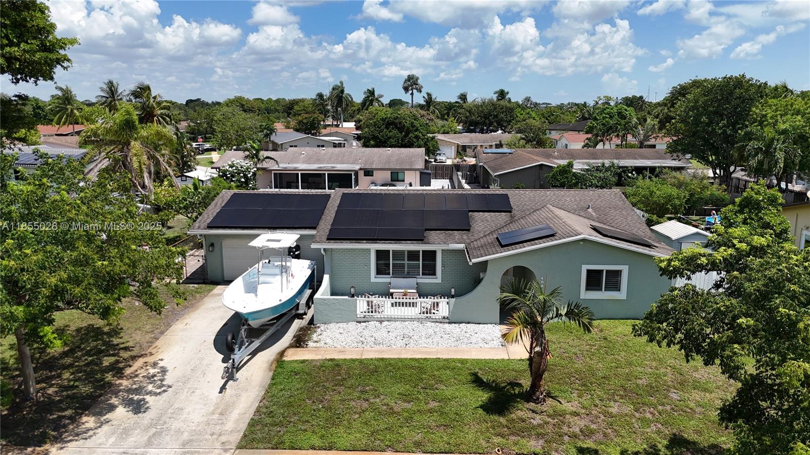 ELECTRIC IS INCLUDED IN THE RENT at this fully remodeled 3-bedroom, 2-bath home with a 2-car garage and Private Pool. The spacious backyard features turf, fruit trees, a lanai, and a fenced layout perfect for relaxing or entertaining. Inside, you'll find wood-look tile floors, impact windows and doors, a sunken living room, and a split floor plan. The kitchen offers white quartz counters, a farmhouse sink, and a large center island with storage. The master suite has a walk-in closet and updated bath. A full cabana bath with pebble stone tile adds a nice touch.