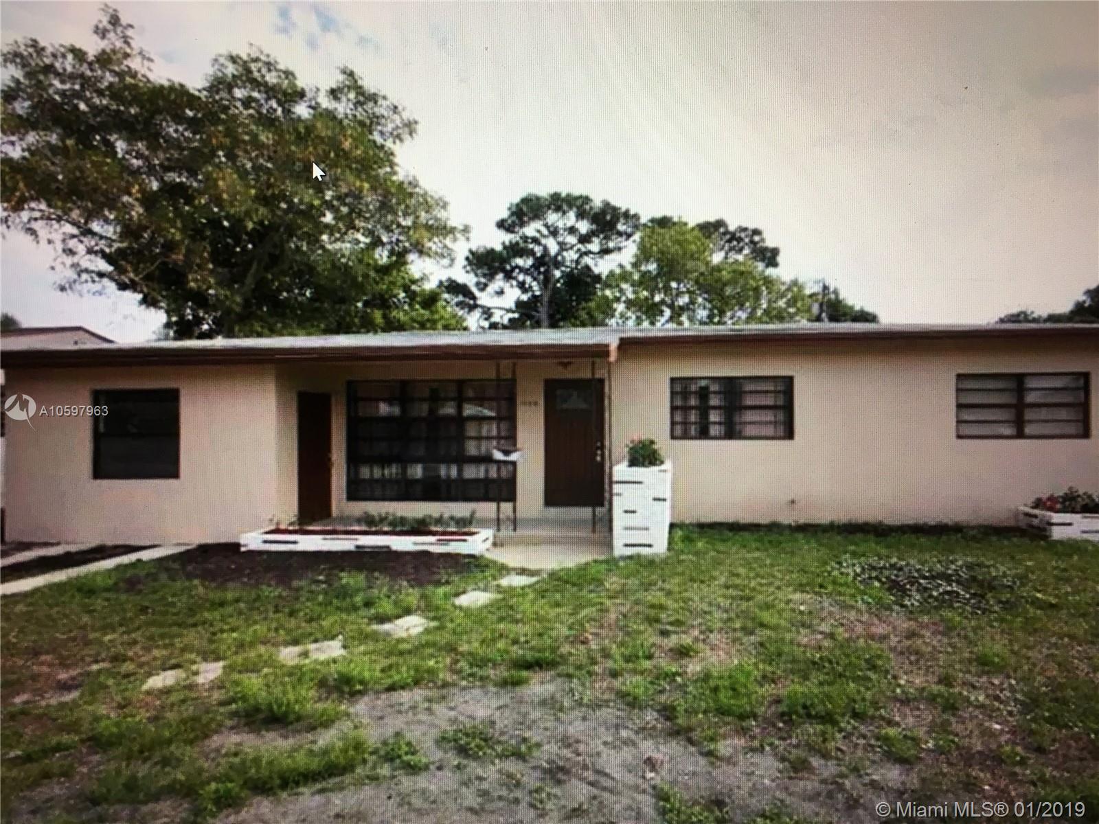 This beautifully upgraded, large, spacious home is over 1,700 square feet. 4 bedrooms/2 bathrooms, tiled throughout, all stainless steel appliances, granite counter-tops, updated bathrooms, brand new roof, brand new 5 ton AC, new sewer connection to city, and much more! Private screened in patio leads to the fenced in back yard, perfect for entertaining! Great investment opportunity! Centrally located close to shopping, restaurants, and major highways. Minutes from the beach and the Hard Rock Hotel & Casino. Must see! Will go fast!