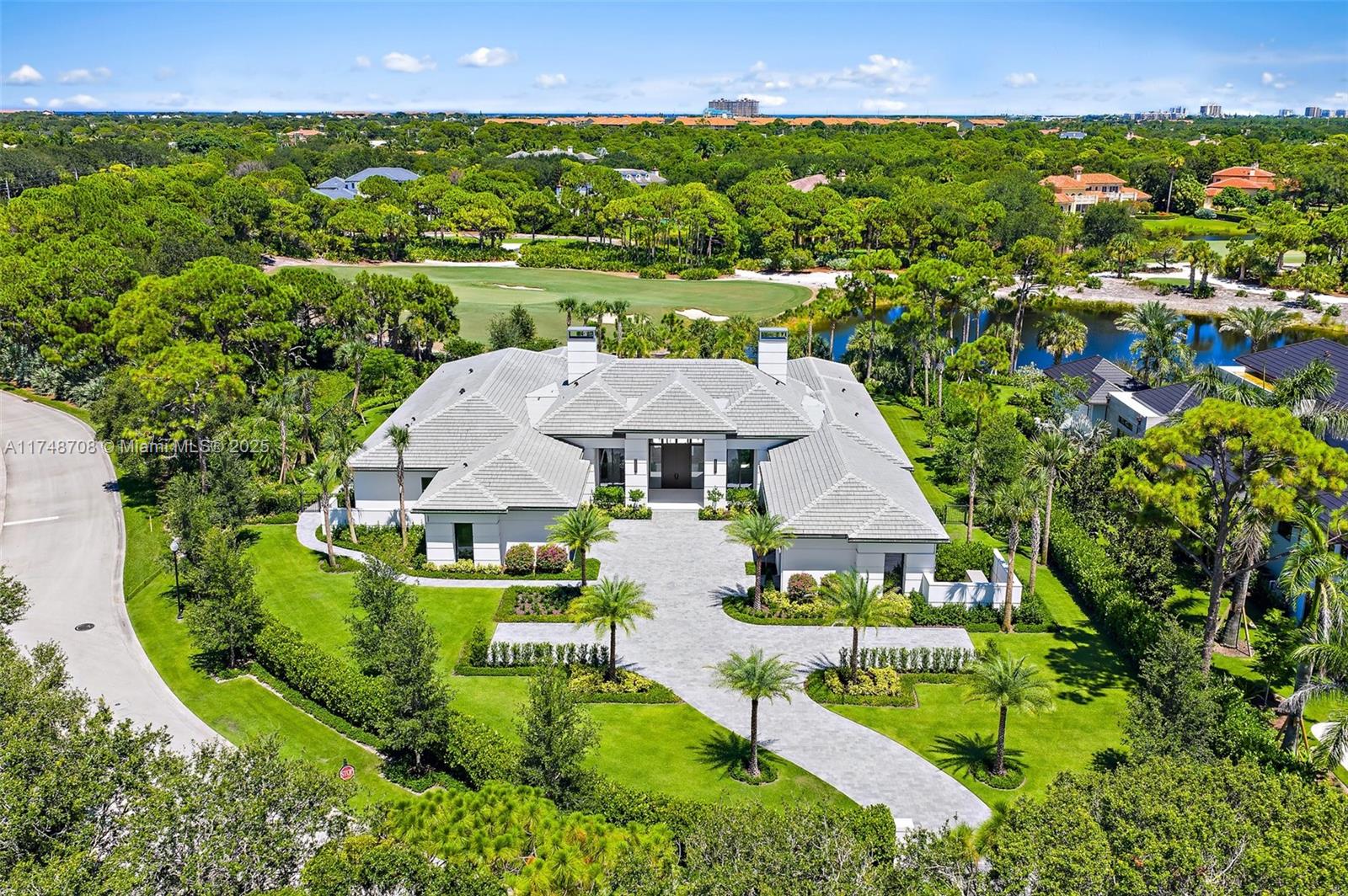 Spectacular customized brand-new one-story home in one of Jupiter's most sought-after communities:Bear’s Club.
This newly delivered residence features an innovative design & top-of-the-line finishes.This home offers 4 spacious suites,6 bathrooms,2 offices with stunning views,two 2-car garages,a climate-controlled golf garage & a whole-house generator.The master suite boasts two magnificent master bathrooms and individual walk-in closets. The gourmet eat-in kitchen is equipped with top-of-the-line, state-of-the-art appliances.The meticulously designed landscaping enhances the breathtaking views.The outdoor area features a swimming pool with jacuzzi, creating the perfect setting for relaxation and entertainment.
Bear's Club is the most exclusive and expansive golf community in the region.