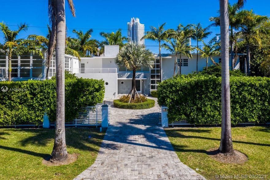 Amazing opportunity to own a waterfront estate with appx.  140' of waterfront. Originally designed by respected architect Igor Polevitzky, in 1938,  updated through the years, to include a detached 2 story  guest house built in 2012 consisting of  3 brs/bth suites, a kitchen and terraces. The main house features 7 brs, with 6 ½ bths, including a cabana bath with sauna,  impact windows/doors, gourmet eat in kitchen, laundry room, media room, family room, expansive master suite w/private  balcony and walk in closet. Ample gardens surround this property, including a covered summer kitchen , heated pool with jacuzzi, a large dock with water and electric. You enter the property unto a large circular gated driveway adjacent to a  3 car garage. Enjoy casual waterfront living, easy to show.